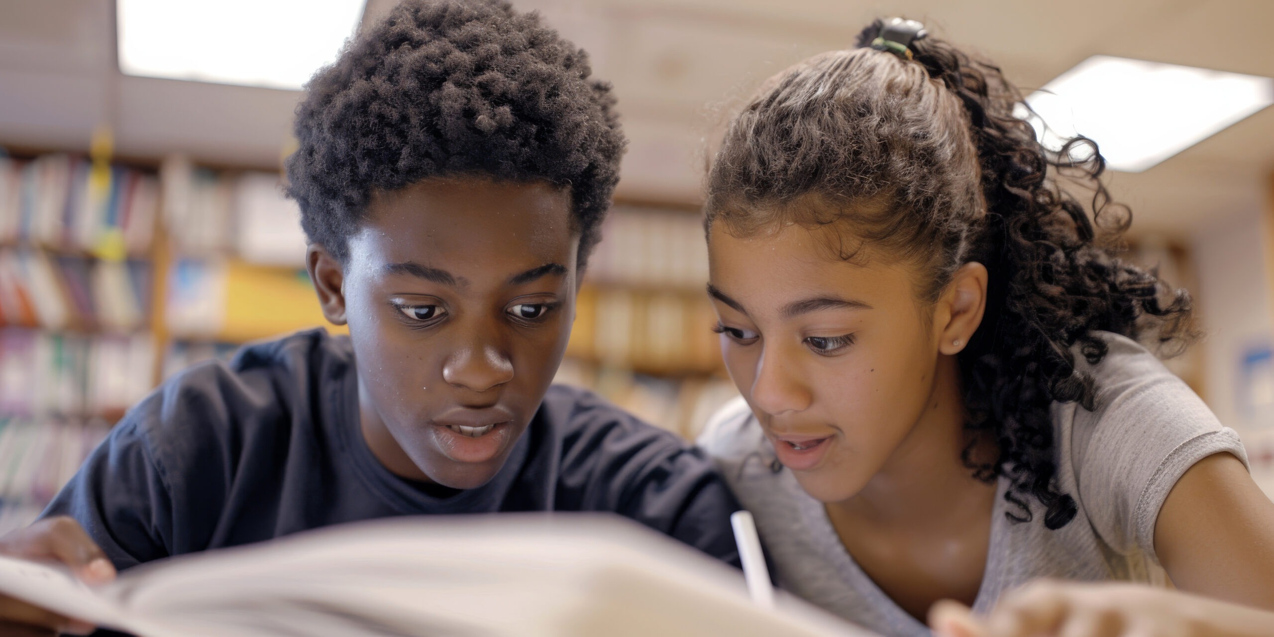 an african american student showing their homework to a teacher